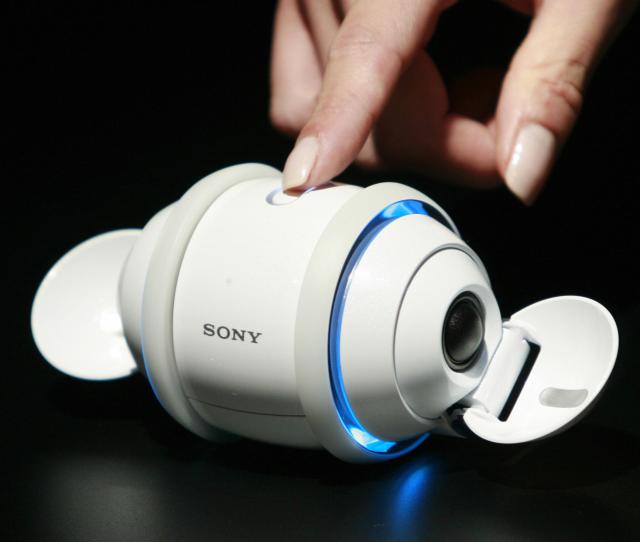 A model displays Japanese electronics giant Sony's robotic music player "Rolly", equipped with 1GB built-in flash memory and mounted stereo speakers on an egg-shaped body, measuring 6.5cm in diameter and 10.4cm in length, to play MP3, ATRAC and AAC coding digital music contents in Tokyo 10 September 2007. Sony will put it on the market 29 September. AFP PHOTO / Yoshikazu TSUNO (Photo credit should read YOSHIKAZU TSUNO/AFP/Getty Images)
