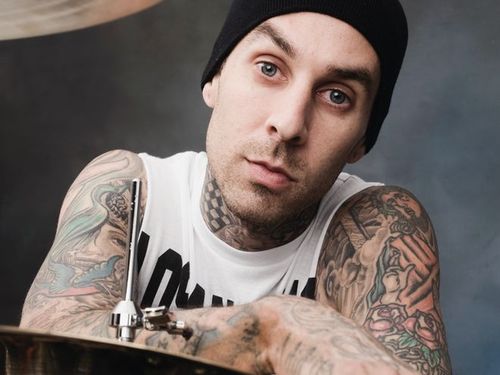 Travis Barker and the flipping acrobat. Naturally there s video